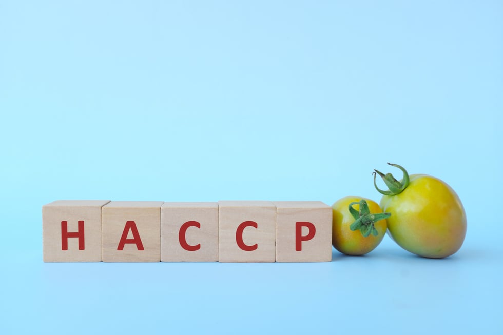 Logo of HACCP - Hazard Analysis and Critical Control Points, a systematic preventive approach to food safety. HACCP-based Food Safety Plans are required for British Columbia food production businesses.
